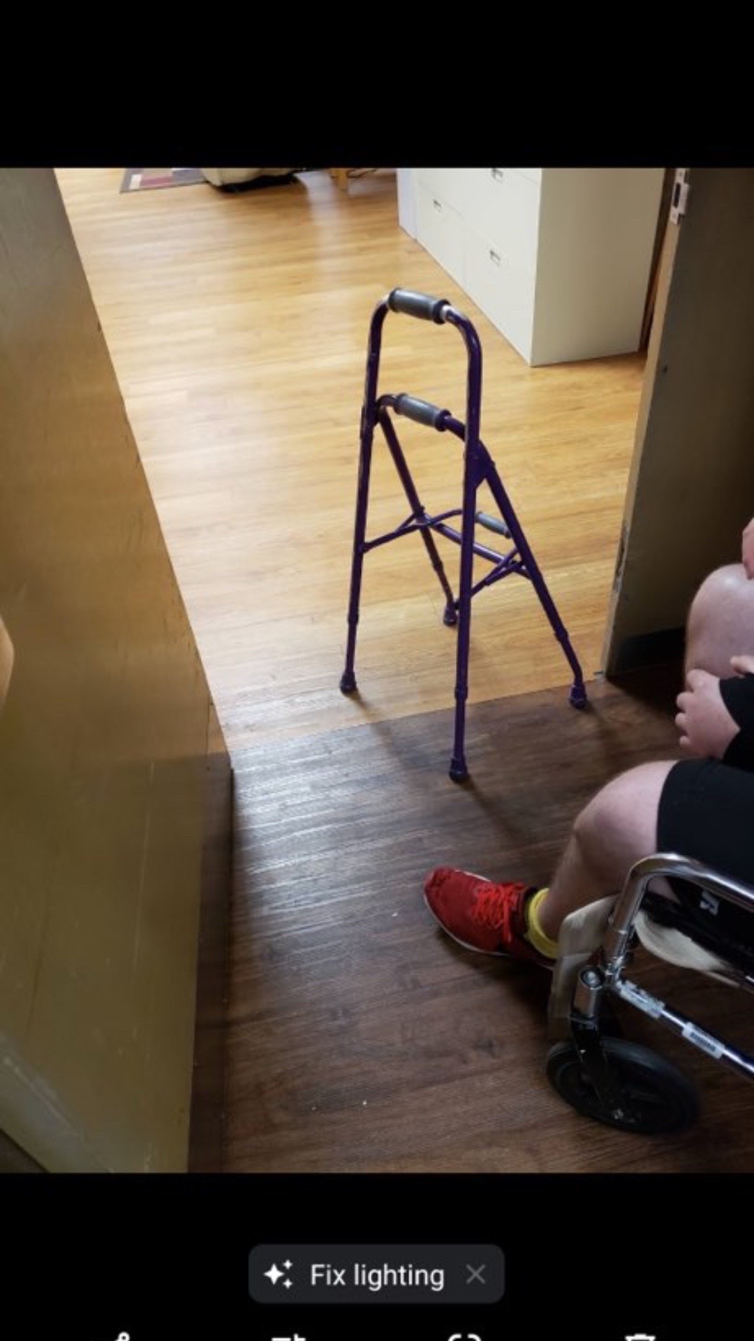Nick Kremers in stroke recovery using a purple walker with therapist assistance